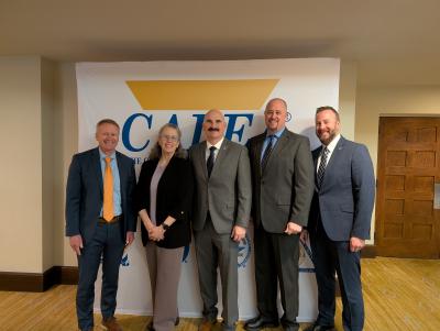 Agency Representatives In front of CALEA Sign