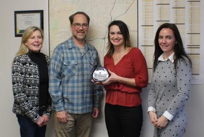 Celeste Krueger presents the Blue Sky Legacy Award to City of Corvallis staff.