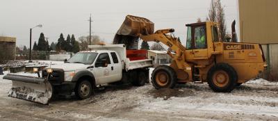 Loading sand into plow truck