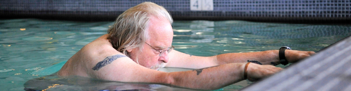 Man stretching in Osborn small therapy pool