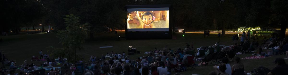Movie playing in avery park at dusk