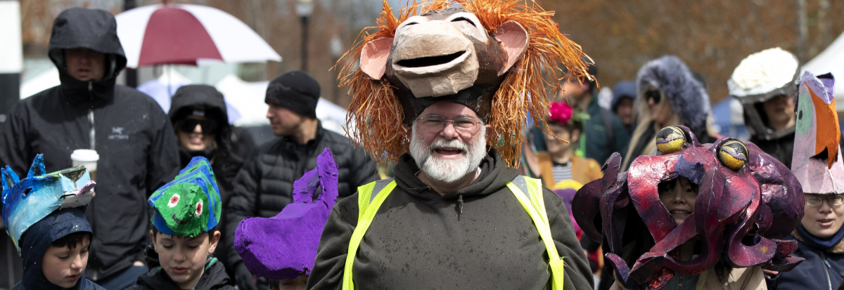 man with large monkey mask, kid with octopus mask