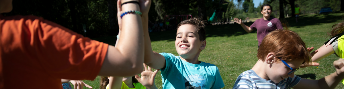 kids running in park, high five