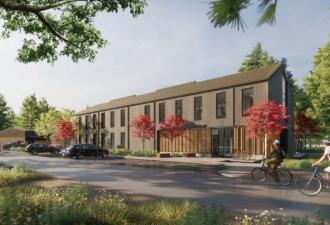 Park Maintenance Facility rendering showing the building in a forested setting with cyclists riding past in the foreground.