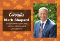 Mark Shepard portrait on an orange pattern background