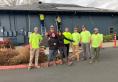 Construction workers in bright yellow shirts standing outside the Corvallis Community Center
