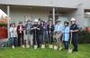 City leaders and fire department officials with shovels and helmets, ready to dig into the green turf at the kickoff event.