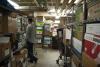 Police department evidence storage area with packages and parcels on shelves.